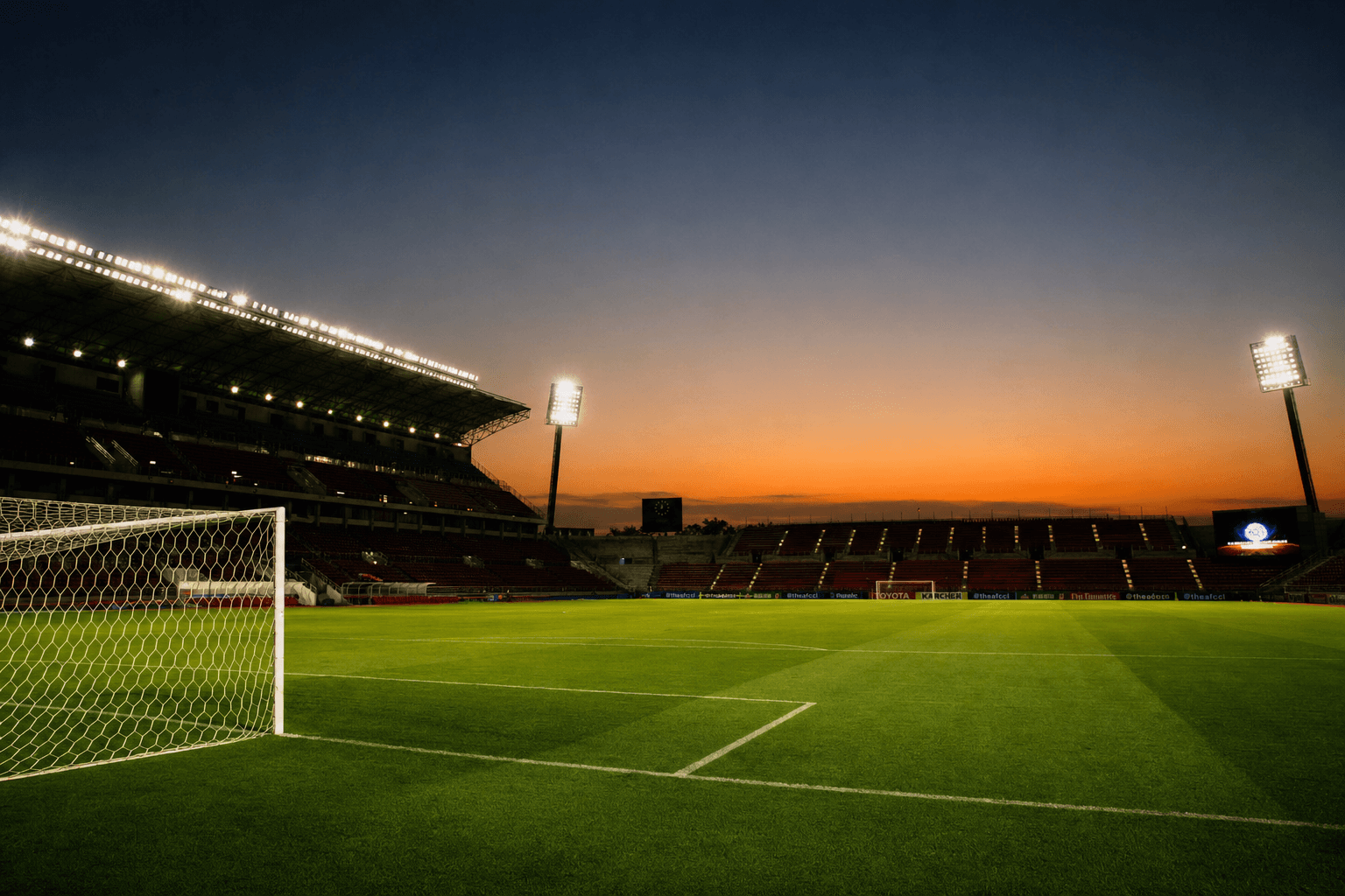 Empty soccer pitch under stadium floodlights at dusk, illustrative editorial photo for 2026 FIFA World Cup coverage